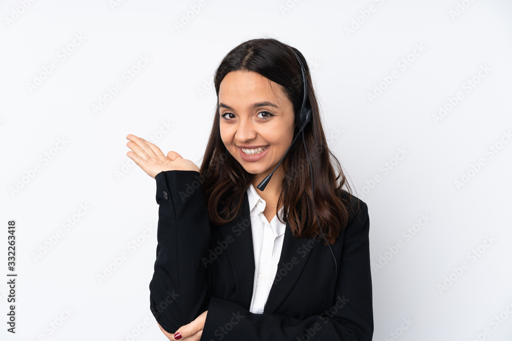 Young telemarketer woman isolated on white background extending hands to the side for inviting to come Young telemarketer woman isolated on white background extending hands to the side for inviting to come