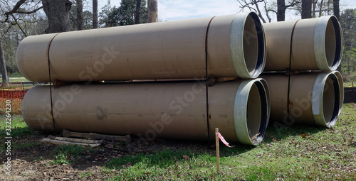 Stacked pipes for culvert construction project.
