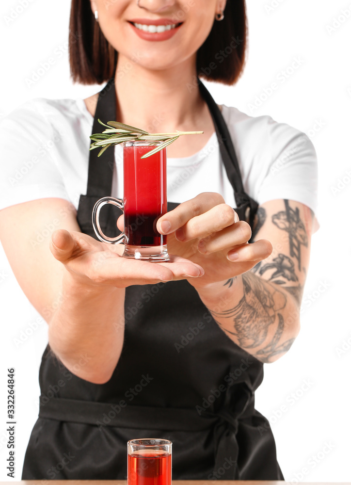 Beautiful female bartender at table against white background