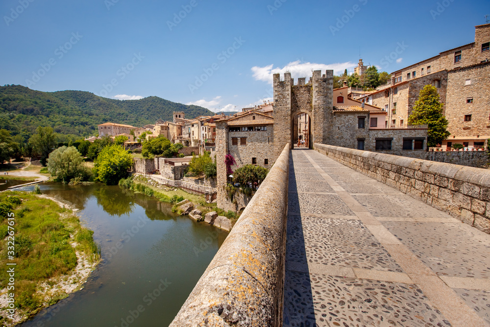 Old bridge over the river Fluvia in medieval town of Besalu, province Girona, Spain