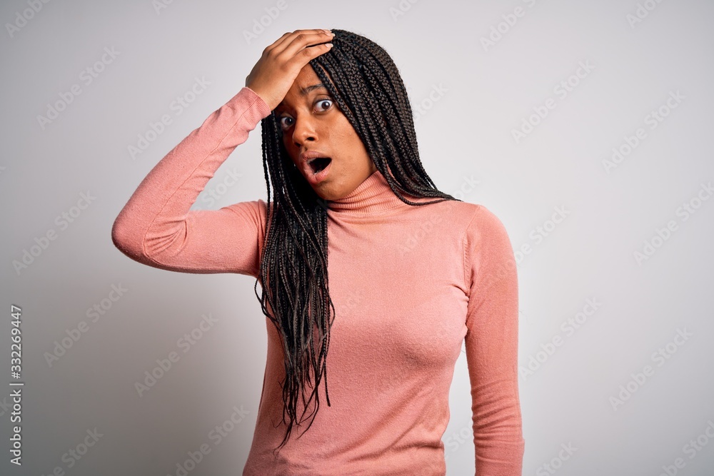 Young african american woman standing casual and cool over white isolated background surprised with hand on head for mistake, remember error. Forgot, bad memory concept. Young african american woman standing casual and cool over white isolated background surprised with hand on head for mistake, remember error. Forgot, bad memory concept.
