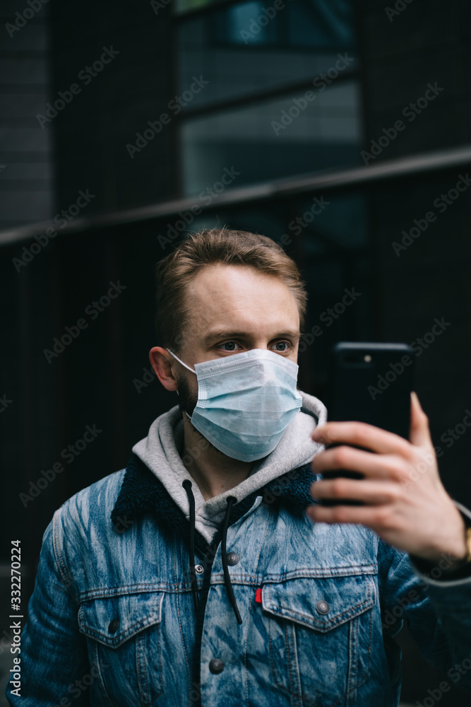 Man in the mask talking by the phone