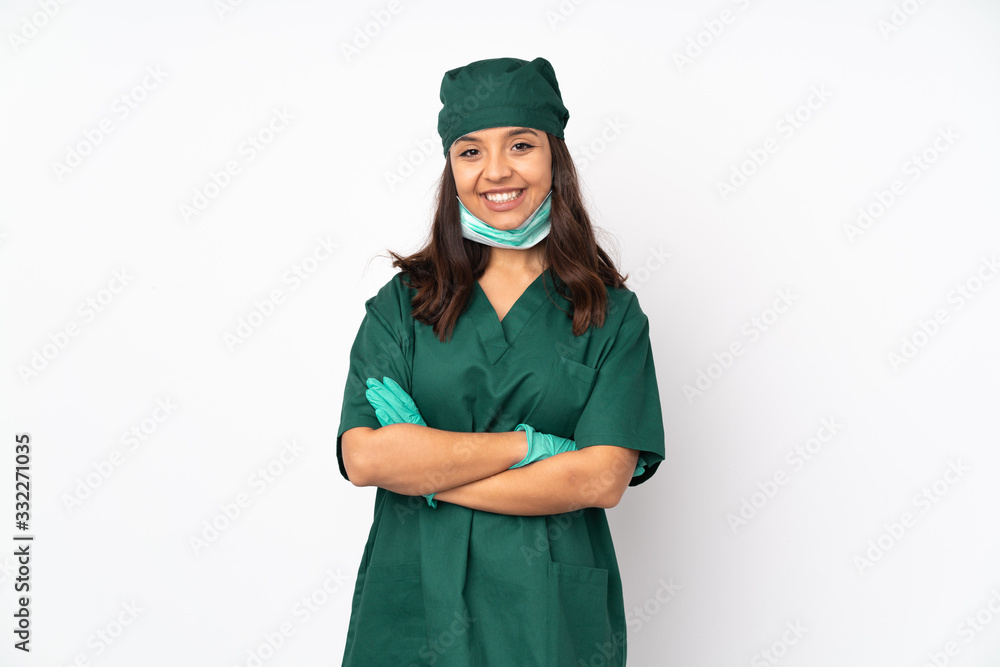 Surgeon woman in green uniform isolated on white background keeping the arms crossed in frontal position Surgeon woman in green uniform isolated on white background keeping the arms crossed in frontal position