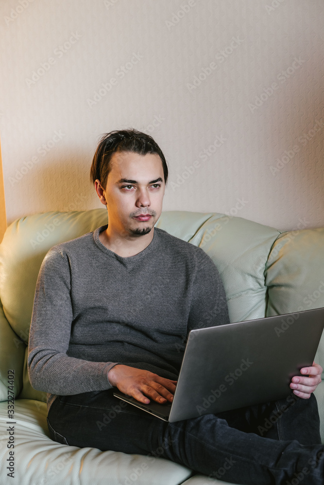man typing on laptop working on freelance at home. man typing on laptop working on freelance at home.