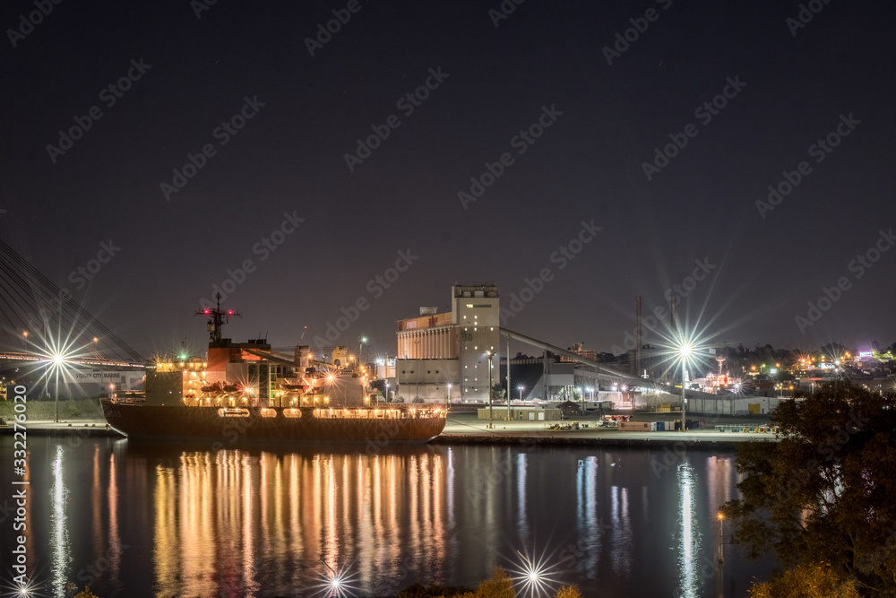 cargo ship in port at night