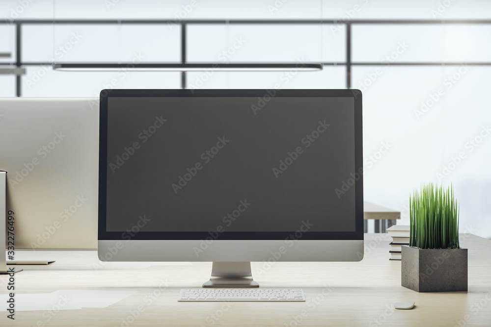 Designer desktop with empty black computer screen Designer desktop with empty black computer screen