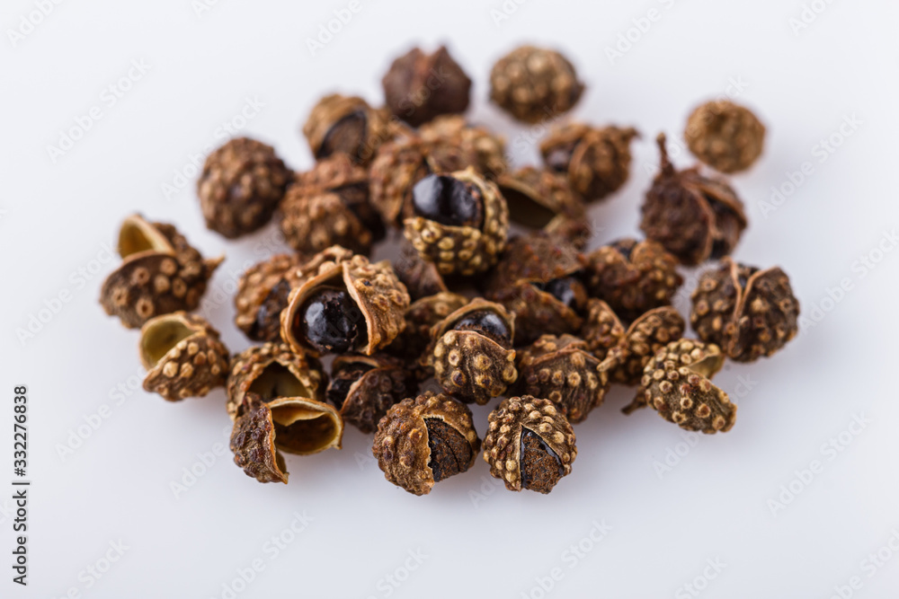 fragrant Sichuan pepper on white acrylic background fragrant Sichuan pepper on white acrylic background