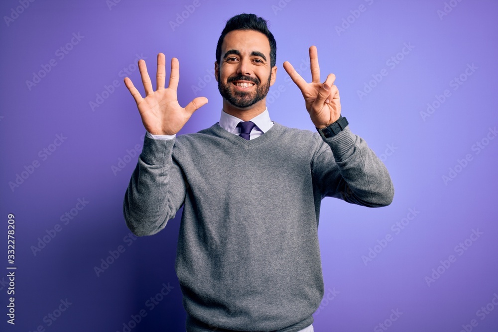Handsome businessman with beard wearing casual tie standing over purple background showing and pointing up with fingers number seven while smiling confident and happy. Handsome businessman with beard wearing casual tie standing over purple background showing and pointing up with fingers number seven while smiling confident and happy.