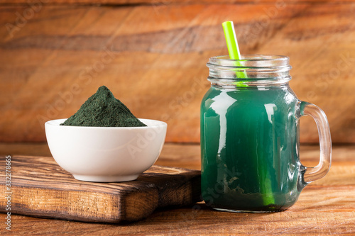 Spirulina is a greenish-blue algae, chlorophyll gives it a green color and phycocyanin gives it a bluish color. photo