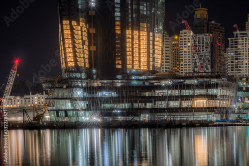 Photography construction site by the water at night