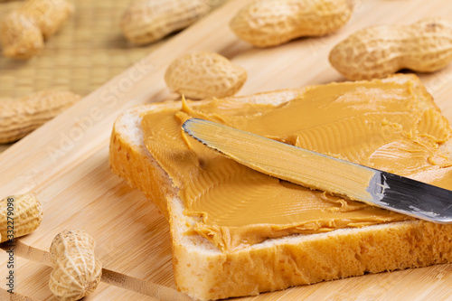 Delicious peanut butter sandwich on a wooden background