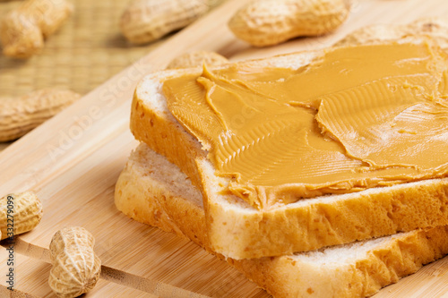 Tableau sur toile Delicious peanut butter sandwich on a wooden background