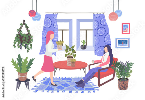 House plants in pots in living room and two women resting and relaxing in hom...