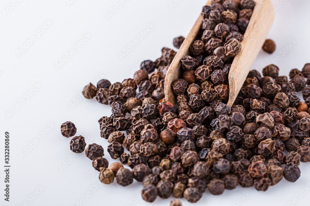 fragrant black pepper on white acrylic background fragrant black pepper on white acrylic background