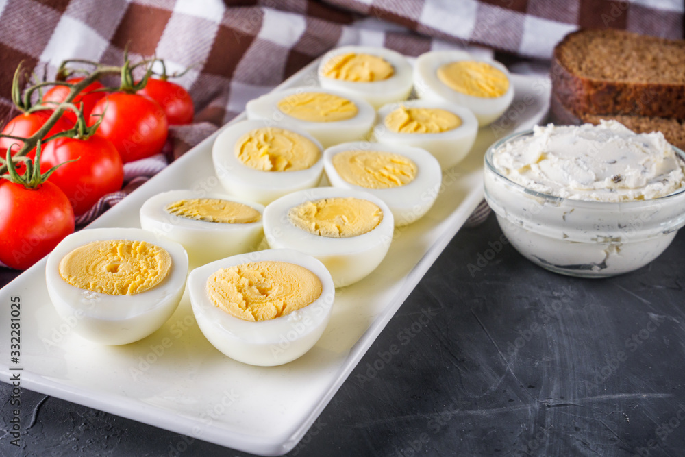 boiled chicken eggs on a dark stone background boiled chicken eggs on a dark stone background