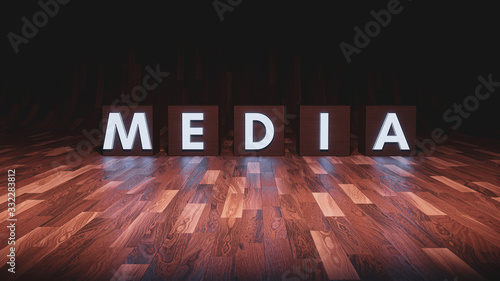 Words on blocks spelling media on a wooden floor