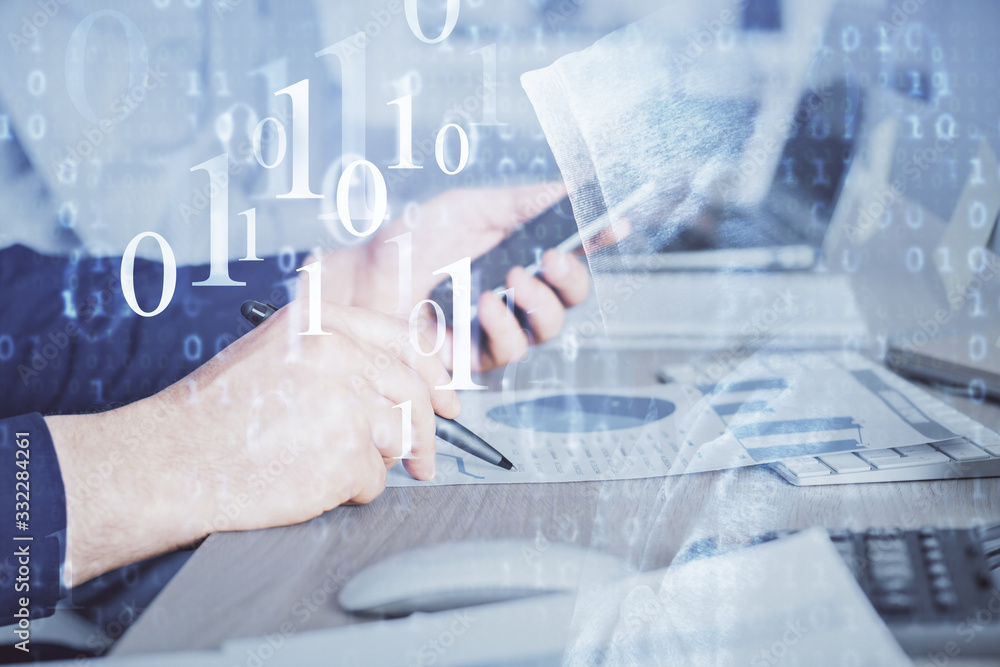 Double exposure of man's hand holding and using a digital device and data theme hologram drawing. Technology concept. Double exposure of man's hand holding and using a digital device and data theme hologram drawing. Technology concept.