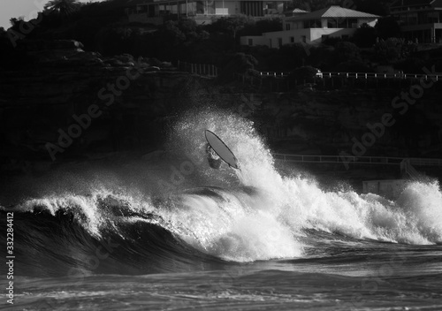 Photography Black and white photo of a surfer wiping out, Sydney Australia