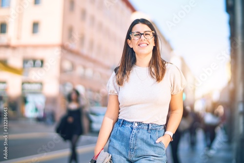 Young beautiful woman smiling happy and confident. Standing with smile on face at the town street © Krakenimages.com