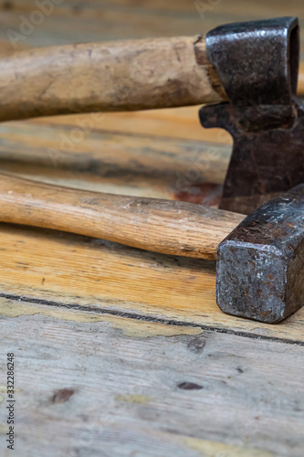 stack ax hammer closeup black work tool wooden background