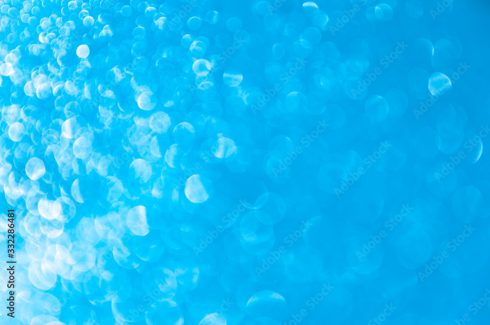 Abstract blue background with bokeh. Gradient glare from left to right. Horizontal background. Abstract blue background with bokeh. Gradient glare from left to right. Horizontal background.