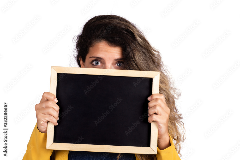 woman holding an empty chalkboard on studio. woman holding an empty chalkboard on studio.
