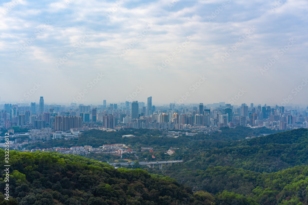Taking photos of Guangzhou downtown at the top of Baiyun Mountain Taking photos of Guangzhou downtown at the top of Baiyun Mountain