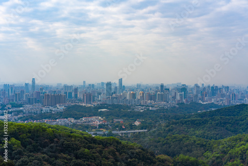 Taking photos of Guangzhou downtown at the top of Baiyun Mountain