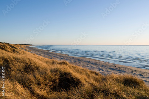 Laesoe / Denmark: Beautiful and calm coastline on the west coast of the island at low tide in the late April afternoon sun