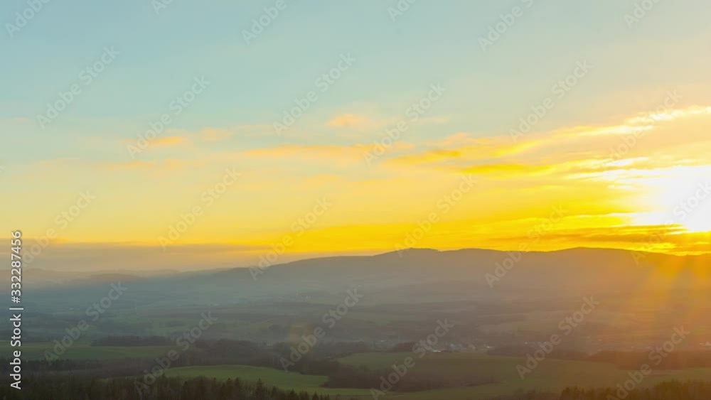 A bright morning sun-kissed sun rays covering the lush green fields in the countryside - time-lapse A bright morning sun-kissed sun rays covering the lush green fields in the countryside - time-lapse