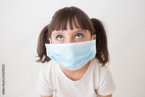 Girl with medical face mask.