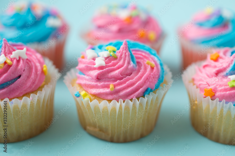 Colorful cupcakes on a  blue background