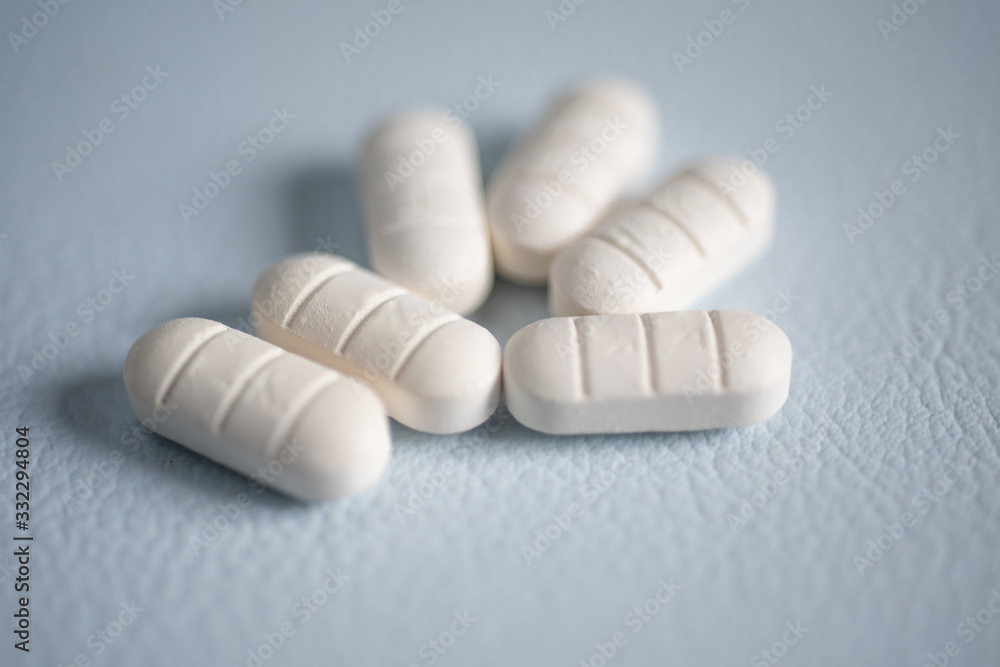 Close up white pills anti viral. Close up white pills anti viral.