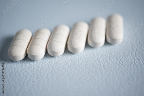 Close up white pills anti viral.