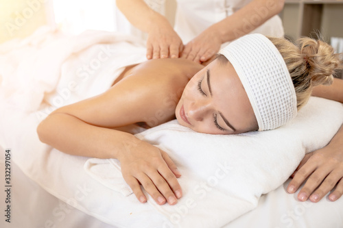 Woman Relaxes in the Spa Body massage Treatment.