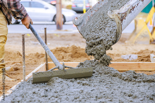 Bilde på lerret Newly poured on laying concrete cement with sidewalk