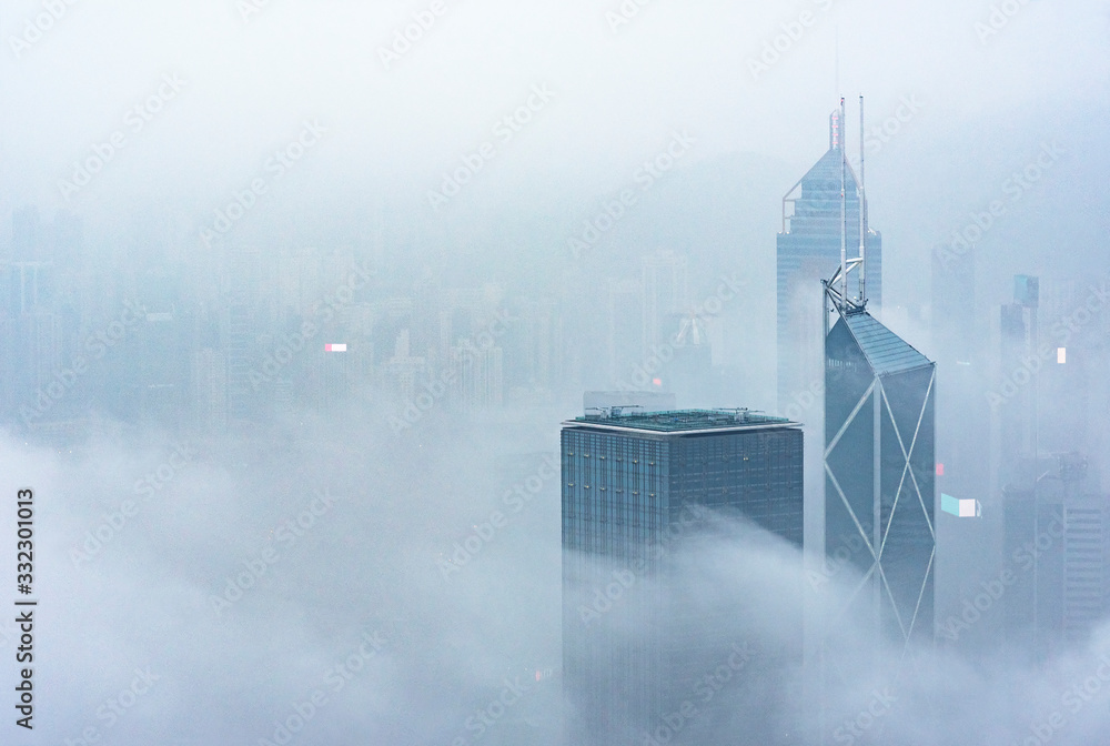 Skyscraper through the fog in Hong Kong city