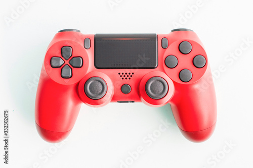 A joystick controller on isolated background, red colored