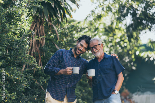 Old father and son, Morning coffee in a garden