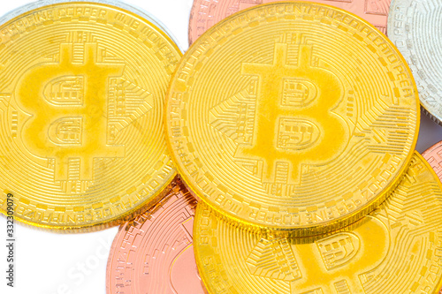 crypto currency gold silver bronzen bitcoin isolated on white photo