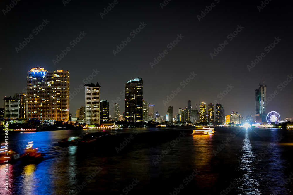 Blur City at night with light bokeh and water reflection Blur City at night with light bokeh and water reflection