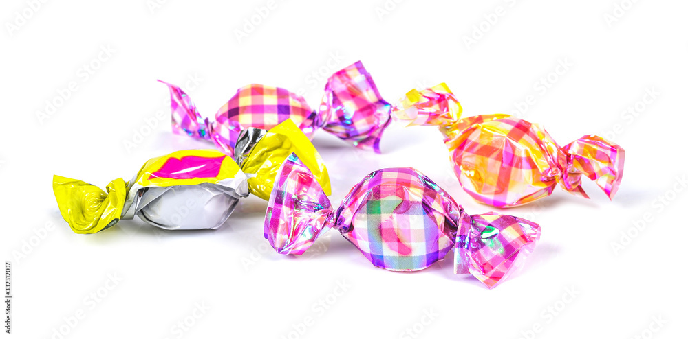 candies wrapped in colored foil on white background