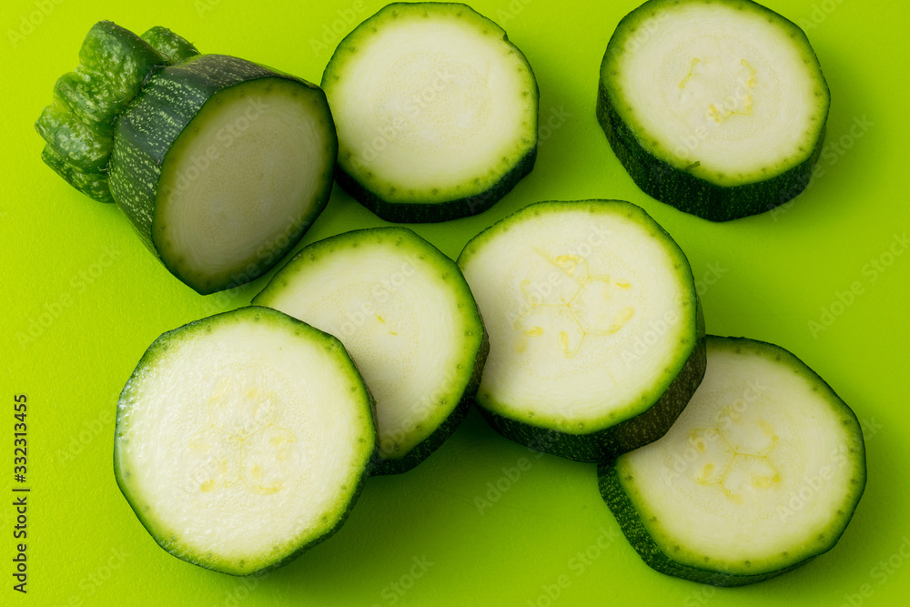 fresh green zucchini slices on green fresh green zucchini slices on green