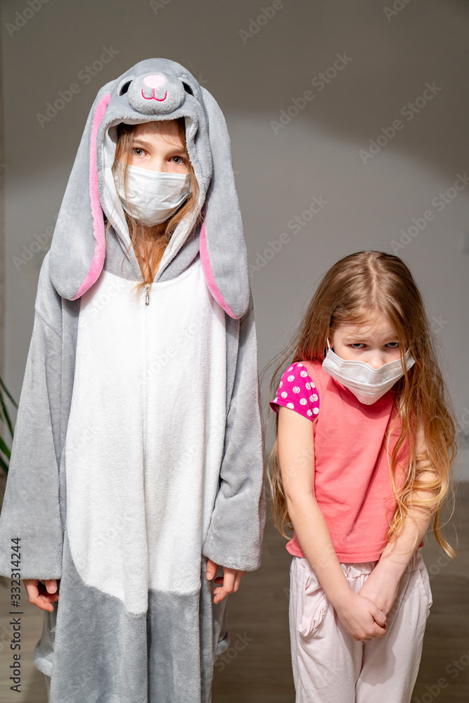 small girls in pajamas, masks quarantine epidemic
