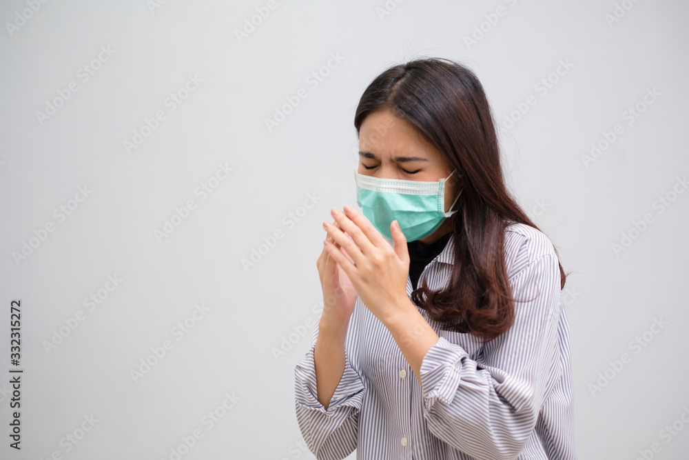 Portrait of a sick flu young woman asian wearing medical mask. Pandemic 2019 Coronavirus 2019-nCoV Concept. Portrait of a sick flu young woman asian wearing medical mask. Pandemic 2019 Coronavirus 2019-nCoV Concept.