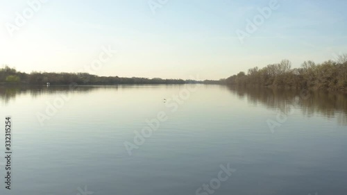Wallpaper Mural Drone Hyperlapse flying over river and chasing big bird flying low. Beautiful sunset and golden colorful nature. Filmed in 4k Torontodigital.ca