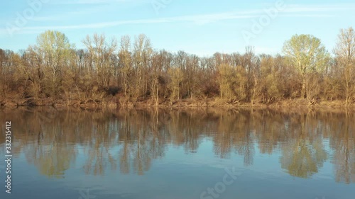 Wallpaper Mural 4k River Areal Landscape side Drone Flying over beautiful river in the middle of Jungle. Shoot at Sunset time, golden hour. Beautiful forest with golden red leafs. Torontodigital.ca