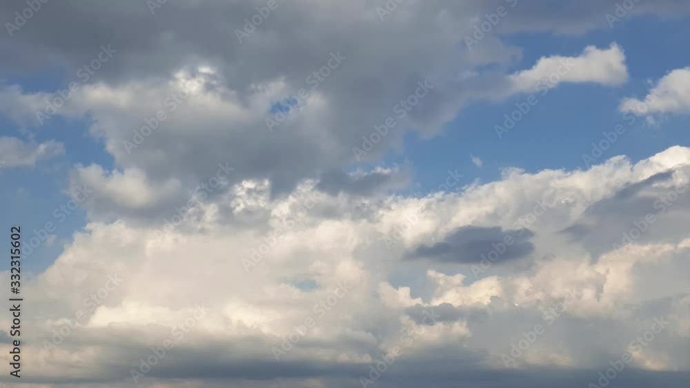 Summer sky rain cloud time lapse in the mid afternoon. fast moving cloud formations. dense thick clouds. Summer sky rain cloud time lapse in the mid afternoon. fast moving cloud formations. dense thick clouds.