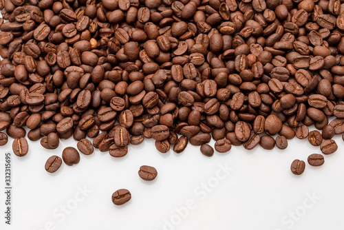 Fototapeta Naklejka Na Ścianę i Meble -  coffee beans close up on a white isolated background,copy space.