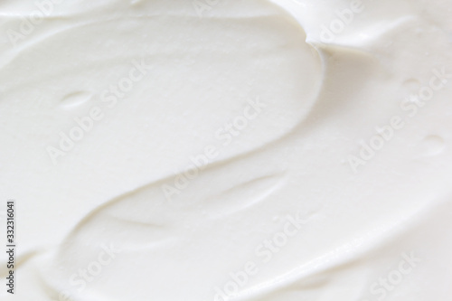 Sour cream  greek yogurt texture. White dairy product sample  creamy mousse closeup. Healthy natural food background